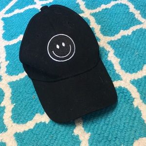 Black smiley face baseball cap